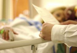 Doctor with dying patient